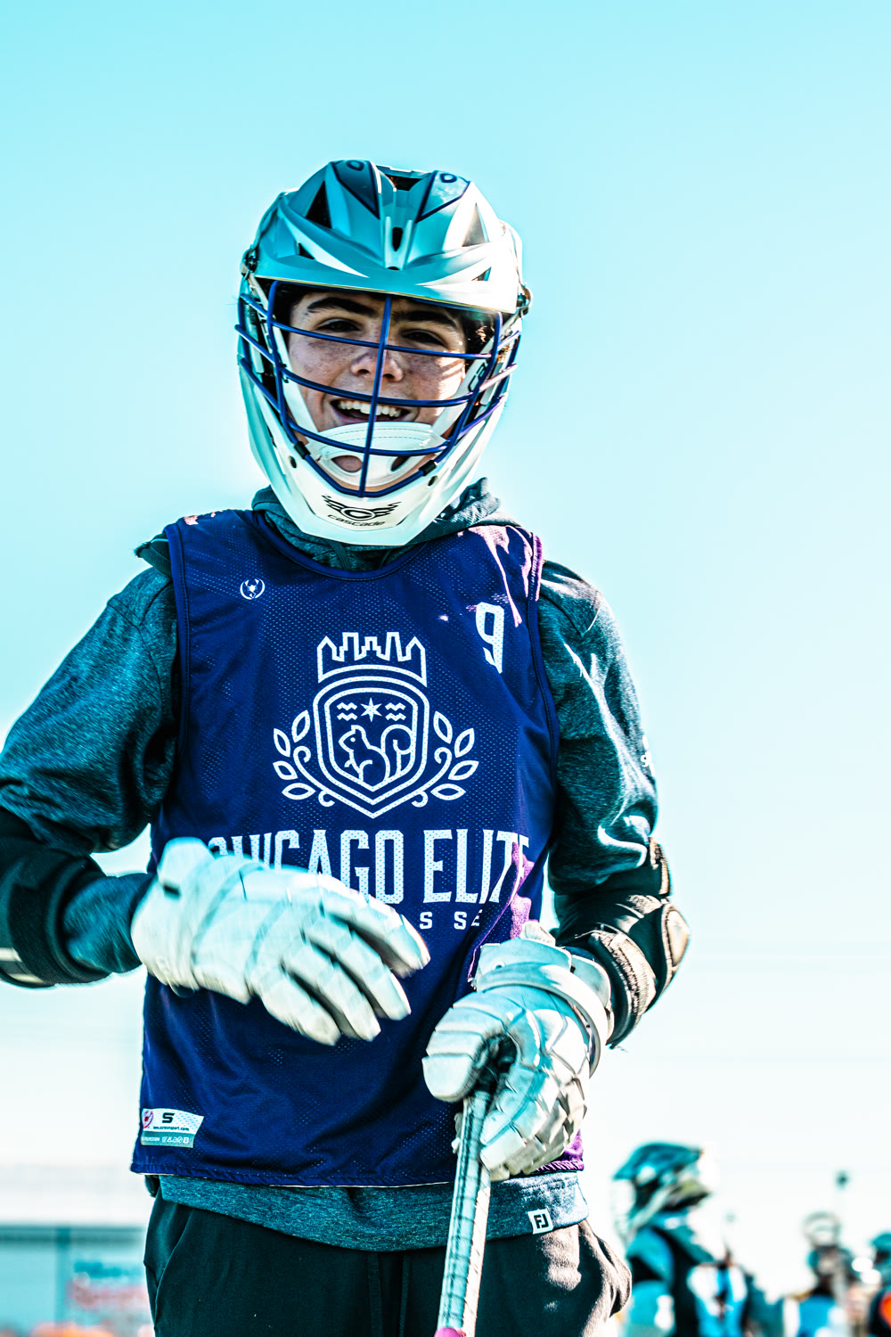 Chicago Elite player smiling in a practice pinnie